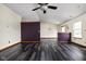 An open-concept living room featuring dark floors, recessed lighting, and a sliding glass door at 504 Countryside Dr, Lebanon, IN 46052