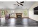 A spacious living room with dark floors and natural light streaming through large windows at 504 Countryside Dr, Lebanon, IN 46052