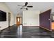 An open-concept living room featuring dark floors and recessed lighting at 504 Countryside Dr, Lebanon, IN 46052