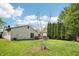 Backyard with lawn, patio, and privacy evergreens at 5323 Shefford Ct, Indianapolis, IN 46254
