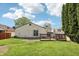 Residential backyard with a patio area and generous lawn at 5323 Shefford Ct, Indianapolis, IN 46254