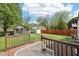 Large backyard with a shed, deck with outdoor furniture, and privacy fence at 5323 Shefford Ct, Indianapolis, IN 46254