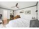 Comfortable bedroom with ceiling fan, neutral walls, and styled shelving at 5323 Shefford Ct, Indianapolis, IN 46254