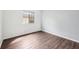This bedroom has wood floors and a window that provides natural light at 5323 Shefford Ct, Indianapolis, IN 46254