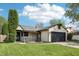 A charming single-Gathering home featuring a two-car garage, cozy porch, and a well-manicured lawn at 5323 Shefford Ct, Indianapolis, IN 46254