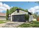 Exterior view of a single-Gathering home with a two-car garage and landscaped front yard at 5323 Shefford Ct, Indianapolis, IN 46254