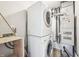 Stacked laundry unit with dryer on top, surrounded by utility hook-ups at 5323 Shefford Ct, Indianapolis, IN 46254