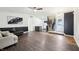 Spacious living room with hardwood floors, a ceiling fan, and an open floor plan at 5323 Shefford Ct, Indianapolis, IN 46254