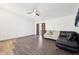 Bright and open living room featuring hardwood floors and comfortable sofa seating at 5323 Shefford Ct, Indianapolis, IN 46254