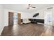 Open-concept living room with hardwood floors, modern furnishings, and sliding wood doors to the backyard at 5323 Shefford Ct, Indianapolis, IN 46254