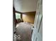 Cozy bedroom featuring a large window for natural light and neutral carpet at 5327 Traditions Dr, Indianapolis, IN 46235