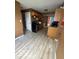 The kitchen features stainless steel appliances, light wood cabinets, and updated floors at 5327 Traditions Dr, Indianapolis, IN 46235