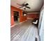 Bright living room showcasing wood-look floors, ceiling fan, and access to the backyard at 5327 Traditions Dr, Indianapolis, IN 46235