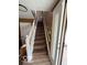 Carpeted staircase leading to the upper level with a white railing at 5327 Traditions Dr, Indianapolis, IN 46235