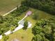 Aerial view showing the outbuildings featuring a garage and workshop on a well manicured lawn at 5607 E 500 N, Greenfield, IN 46140