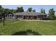 View of backyard with deck, hot tub and large grassy area at 5607 E 500 N, Greenfield, IN 46140