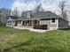 Spacious backyard featuring a hot tub and a deck, perfect for outdoor relaxation and entertaining at 5607 E 500 N, Greenfield, IN 46140