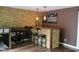 Finished basement bar area with stone accents, pendant lights, seating, and sports-themed decor at 5607 E 500 N, Greenfield, IN 46140
