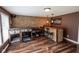 Basement bar area with custom stone accents, built-in shelving, and unique lighting fixtures at 5607 E 500 N, Greenfield, IN 46140