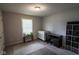 Finished basement showcasing window view, tool storage, desk, and storage shelving at 5607 E 500 N, Greenfield, IN 46140
