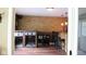 View of basement with stone accent wall and bar area with dark wood-look flooring at 5607 E 500 N, Greenfield, IN 46140