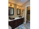 Bathroom features dual vessel sinks, granite countertops, dark wood cabinets, and modern fixtures at 5607 E 500 N, Greenfield, IN 46140