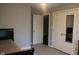 Bedroom with neutral walls and carpet, featuring large closets and white doors at 5607 E 500 N, Greenfield, IN 46140
