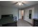 Bright bedroom with a neutral color scheme, mirrored closet, and a ceiling fan at 5607 E 500 N, Greenfield, IN 46140