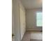 Bedroom with a window that offers a view and a large closet next to the carpeted floors at 5607 E 500 N, Greenfield, IN 46140