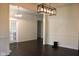 Spacious dining room featuring hardwood floors, elegant lighting, and ample room for entertaining at 5607 E 500 N, Greenfield, IN 46140