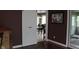 The dining room features dark walls with white trim, an open doorway, and natural lighting at 5607 E 500 N, Greenfield, IN 46140