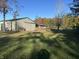 A house and barn on a large lot with mature trees and a sprawling lawn at 5607 E 500 N, Greenfield, IN 46140