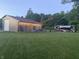 Exterior of building with string lights, outdoor seating, and an RV parked nearby at 5607 E 500 N, Greenfield, IN 46140