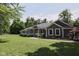 Well-maintained home featuring a green lawn, tasteful landscaping, and a welcoming front porch perfect for relaxing at 5607 E 500 N, Greenfield, IN 46140