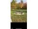 Outdoor fire pit area perfect for entertaining with a stone surround and plenty of seating at 5607 E 500 N, Greenfield, IN 46140