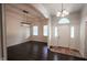 Bright foyer featuring a decorative light fixture, beautiful tile flooring, and abundant natural light at 5607 E 500 N, Greenfield, IN 46140