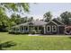 Charming single-story home with a welcoming front porch and well-manicured lawn at 5607 E 500 N, Greenfield, IN 46140