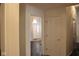 Hallway view with wooden floors leading to the front door of the house with natural light at 5607 E 500 N, Greenfield, IN 46140