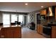 Open kitchen with stainless steel appliances, granite countertops, and an adjacent dining area with lots of natural light at 5607 E 500 N, Greenfield, IN 46140