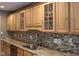 Kitchen featuring granite counters, mosaic tile backsplash, and stainless steel appliances at 5607 E 500 N, Greenfield, IN 46140
