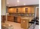 Open eat-in kitchen featuring stainless steel appliances, granite countertops, and natural wood cabinets at 5607 E 500 N, Greenfield, IN 46140