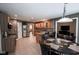 Spacious kitchen with stainless steel appliances, granite countertops, island seating, and tile flooring at 5607 E 500 N, Greenfield, IN 46140
