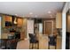 Spacious kitchen with bar seating, stainless steel appliances, granite countertops, and wood cabinetry at 5607 E 500 N, Greenfield, IN 46140
