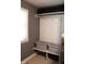 This laundry room features a built-in folding bench, baskets, and window at 5607 E 500 N, Greenfield, IN 46140