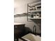 This laundry room features a sink and metal shelving at 5607 E 500 N, Greenfield, IN 46140