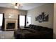Comfortable living room with a large sectional, fireplace, and an open layout for entertaining guests at 5607 E 500 N, Greenfield, IN 46140