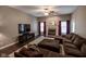Spacious living room with a fireplace, large television, and comfortable sectional sofa at 5607 E 500 N, Greenfield, IN 46140