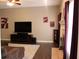 Cozy living room with a TV, fireplace, and comfortable seating area for relaxation and entertainment at 5607 E 500 N, Greenfield, IN 46140