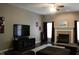 Inviting living room with a fireplace, dark wood flooring, and a comfortable sectional sofa at 5607 E 500 N, Greenfield, IN 46140