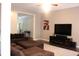 Spacious living room with a fireplace, large sectional sofa, and ample natural light at 5607 E 500 N, Greenfield, IN 46140